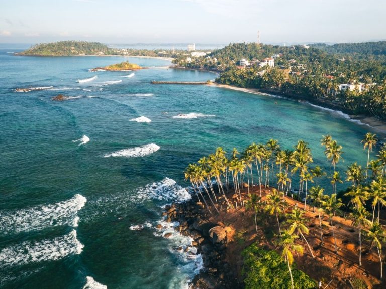 Aerial view of a palm-lined bay on Sri Lanka’s southern coast.